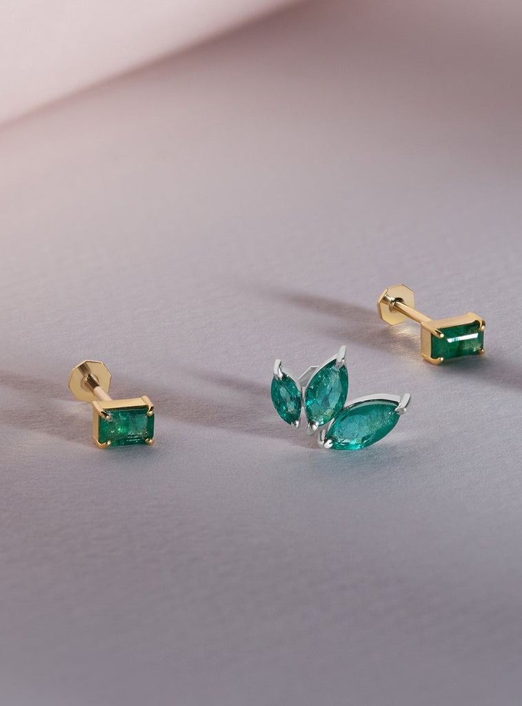 3 Emerald Marquise Stones  . Yellow Gold Piercing
